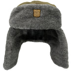 Front view of the Cold War era Czech Army Ushanka showcasing the thick grey faux fur lining and signature golden military badge.