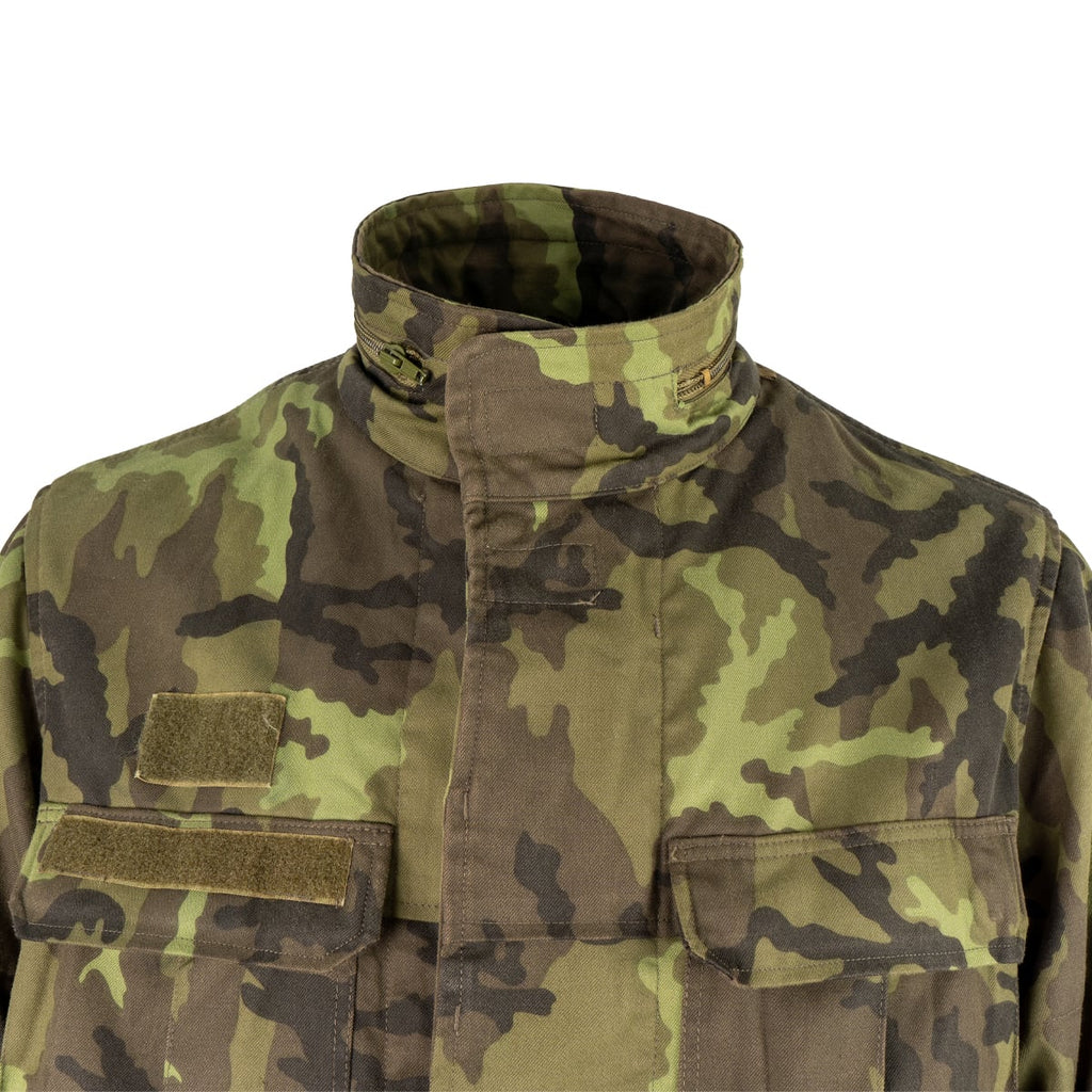 Close-up of the Czech Army M95 field jacket collar and chest pockets with Velcro attachment points.