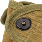 Close-up detail of the brass Lift-the-Dot stud fastener on the authentic Danish M45 military canteen pouch, showcasing vintage construction and durable materials.