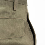 Close-up of the rear flap pocket detailing on durable East German NVA military trousers, showcasing authentic stitching.