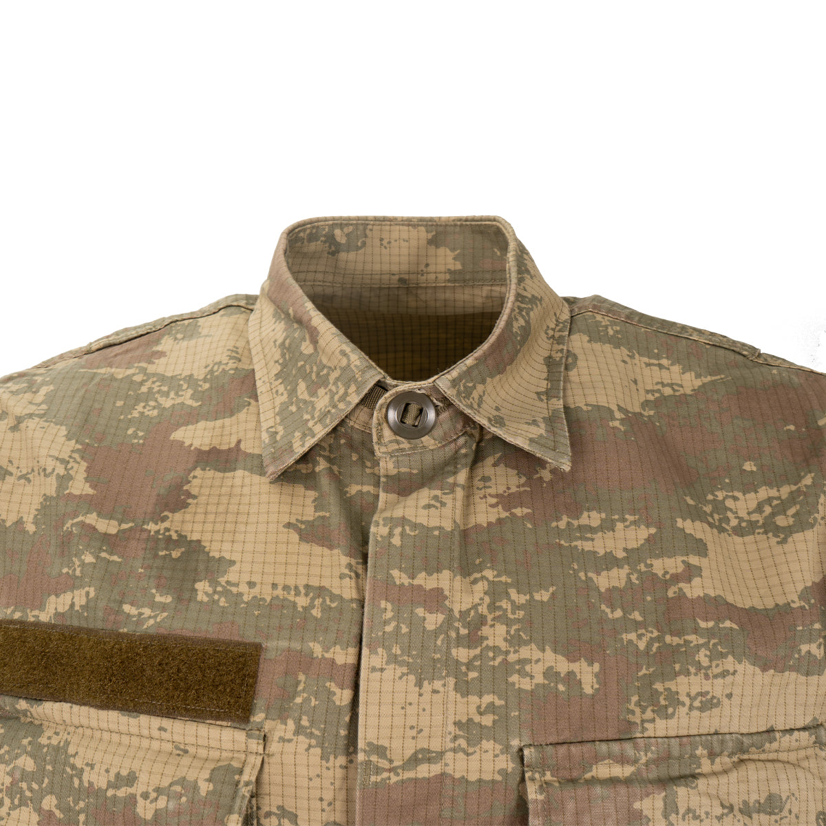Close-up of the spread collar and button-down placket on the Turkish military field shirt made from durable, grid-patterned ripstop fabric.
