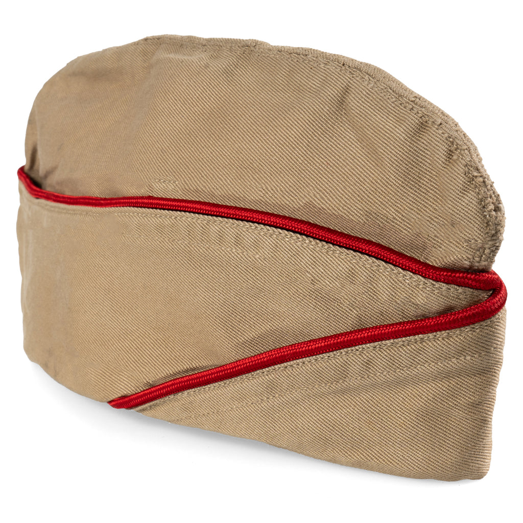 A side view of the WW2 US Army Khaki Garrison Cap, showcasing the foldable design and vibrant red piping.