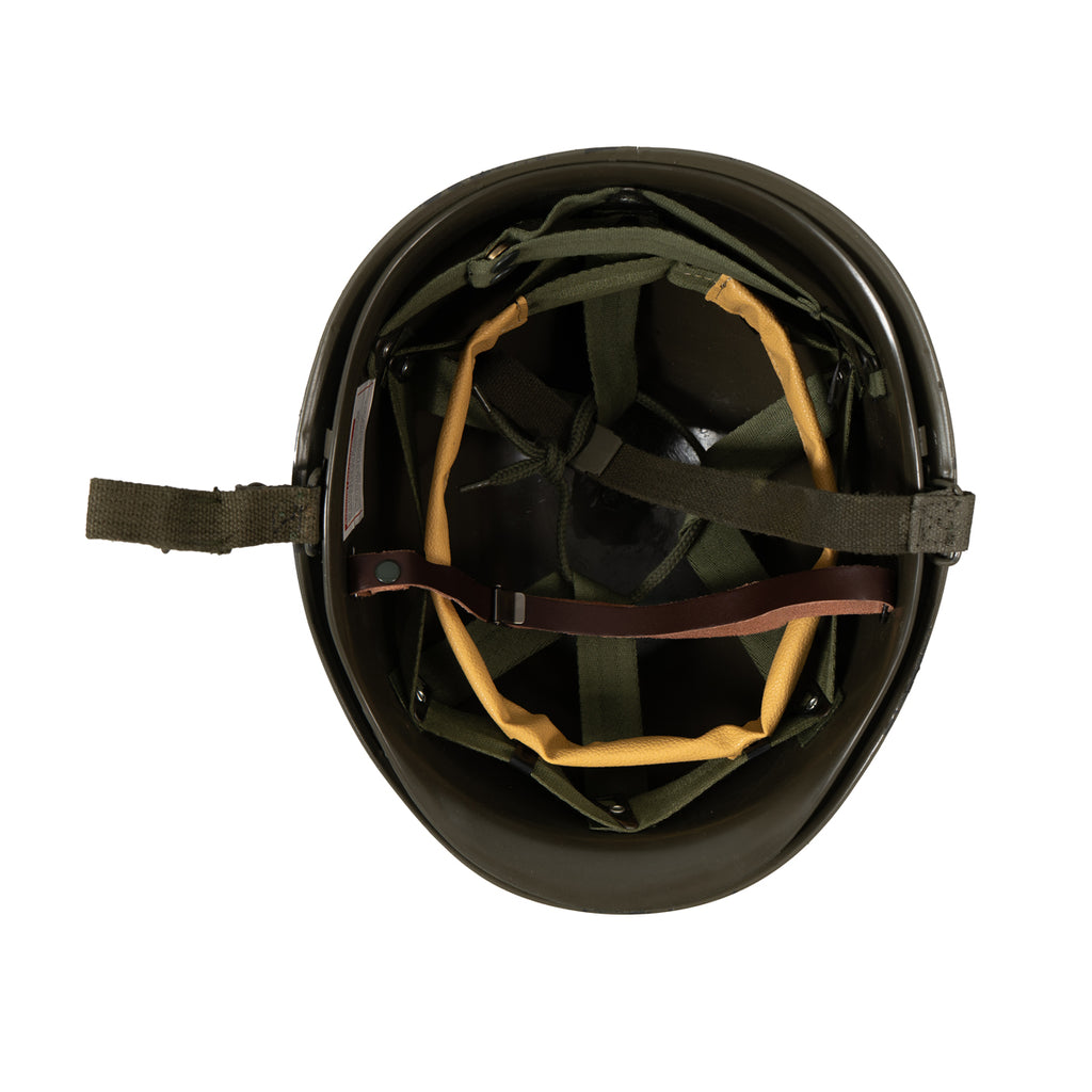 Interior view of the US M1 helmet showing the adjustable plastic liner system and straps.