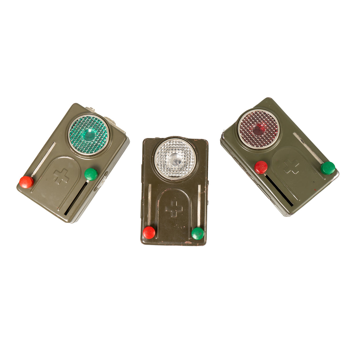 Three Cold War era Swiss Army signalling torches showing variations in red, green, and clear lens positions.
