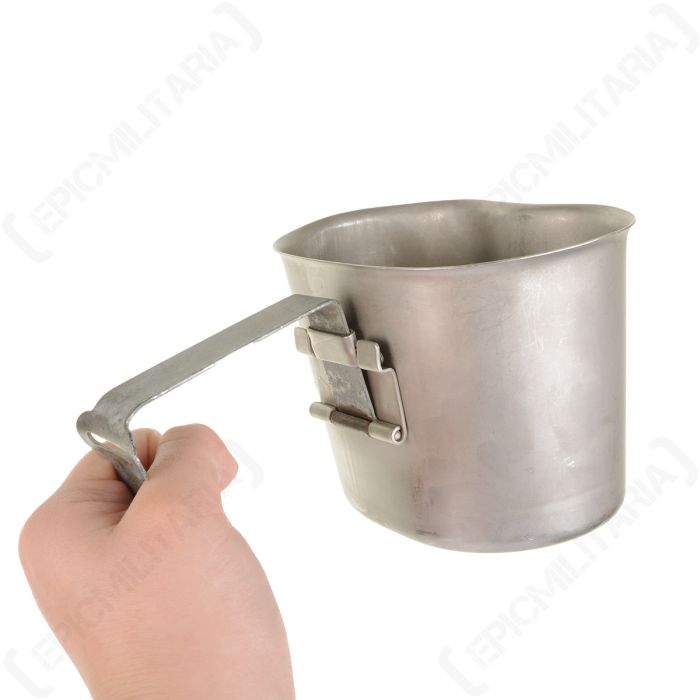 Holding the Belgian Army canteen cup by its unfolded locking handle