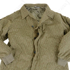 Front view of unbuttoned East German Strichtarn jacket showing button fly and inner lining