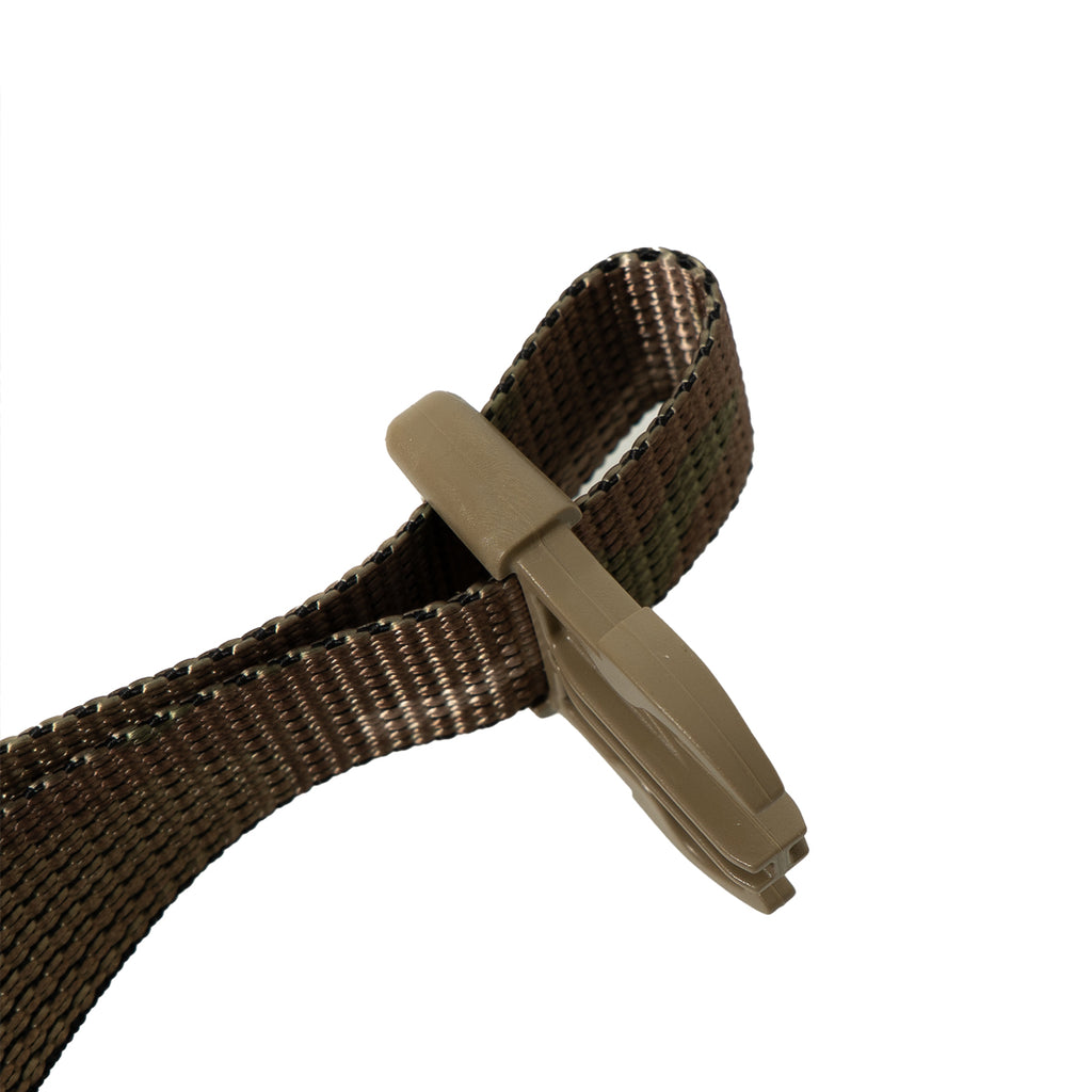 Angled close-up of a tan side-release buckle used for secure attachment on this British Army surplus side pouch strap.