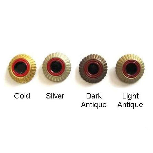 Four metal German Army roundels featuring a ridged edge and black center, displayed in gold, silver, dark antique, and light antique finishes.
