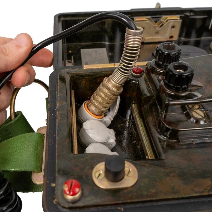 Handset cord plug and spring relief connected to East German field phone socket
