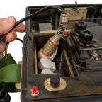 Handset cord plug and spring relief connected to East German field phone socket