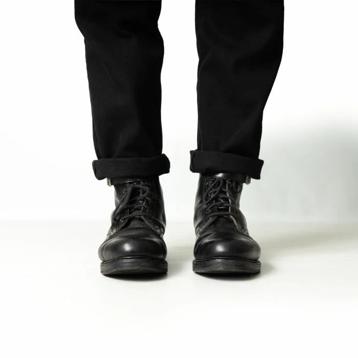 Front view of black Austrian Army double buckle combat boots on feet