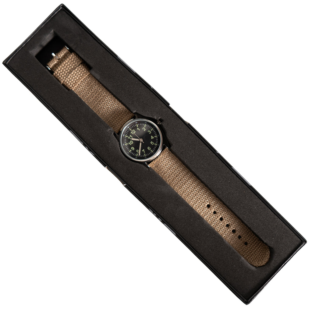 Top-down view of the 1980s British Airman-style quartz watch presented inside its sleek black collector's box.