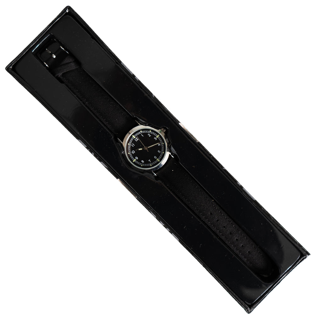 The 1950s British RAF military watch resting inside its sleek black presentation display box.