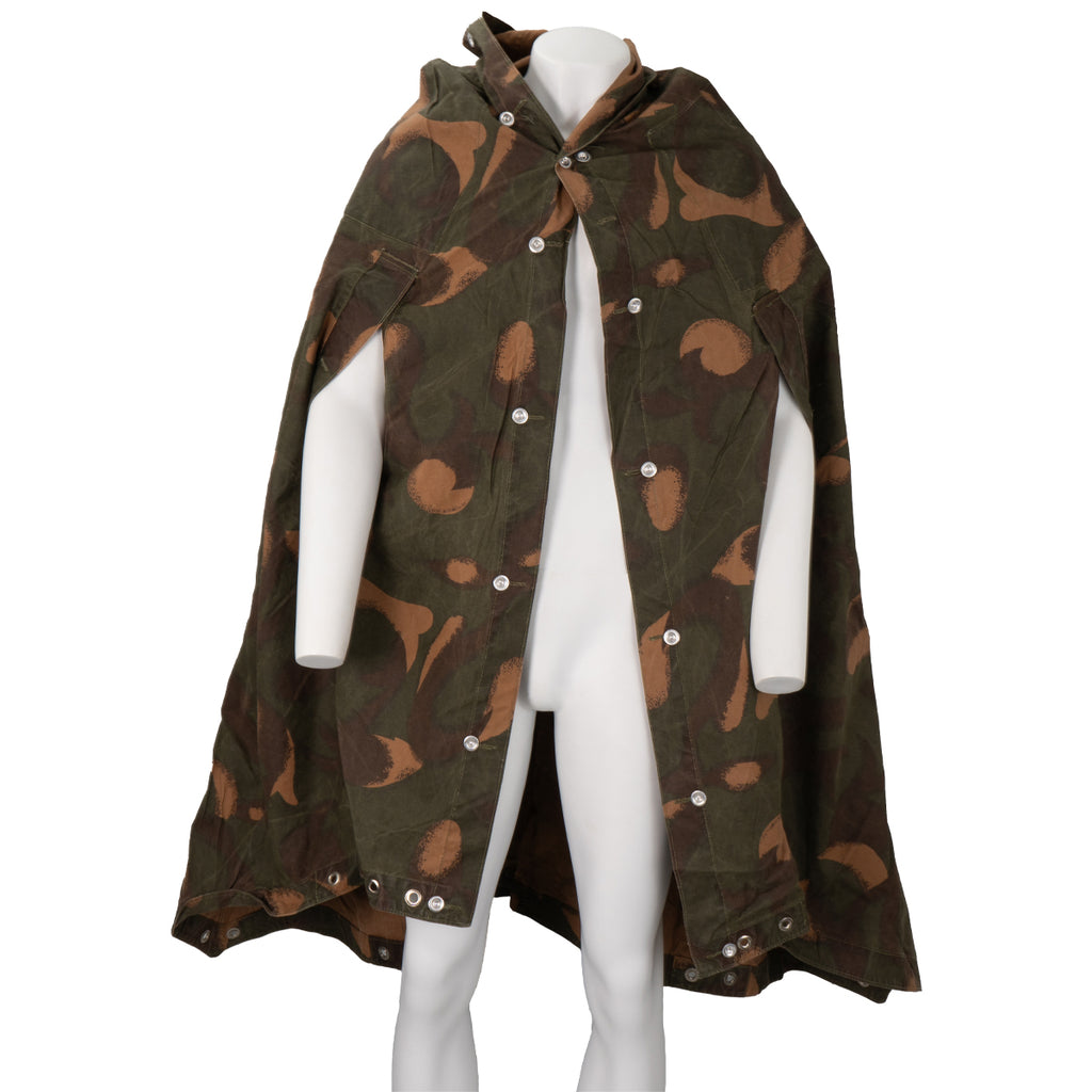 Front view of Hungarian M82 Zeltbahn worn as a poncho on a mannequin featuring olive and brown camouflage.