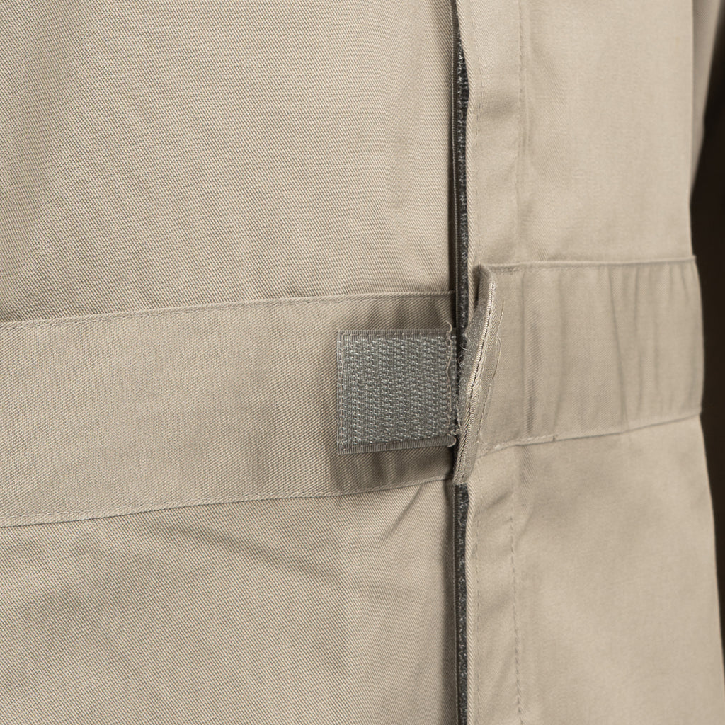 Close-up of the robust hook-and-loop waist adjuster on the RAF coveralls, designed for a customized, secure fit.