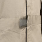 Close-up of the robust hook-and-loop waist adjuster on the RAF coveralls, designed for a customized, secure fit.