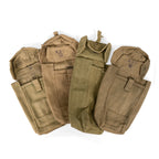 Group of four original Belgian Army pouches with varied shades of khaki and visible ABL stamps, showcasing authentic military wear.