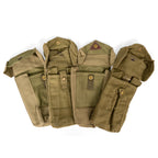 Selection of four Belgian Army magazine pouches arranged to show variation in wear and authentic surplus character.