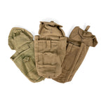 Three vintage military pouches displayed together, highlighting unique textures and historical signs of use.