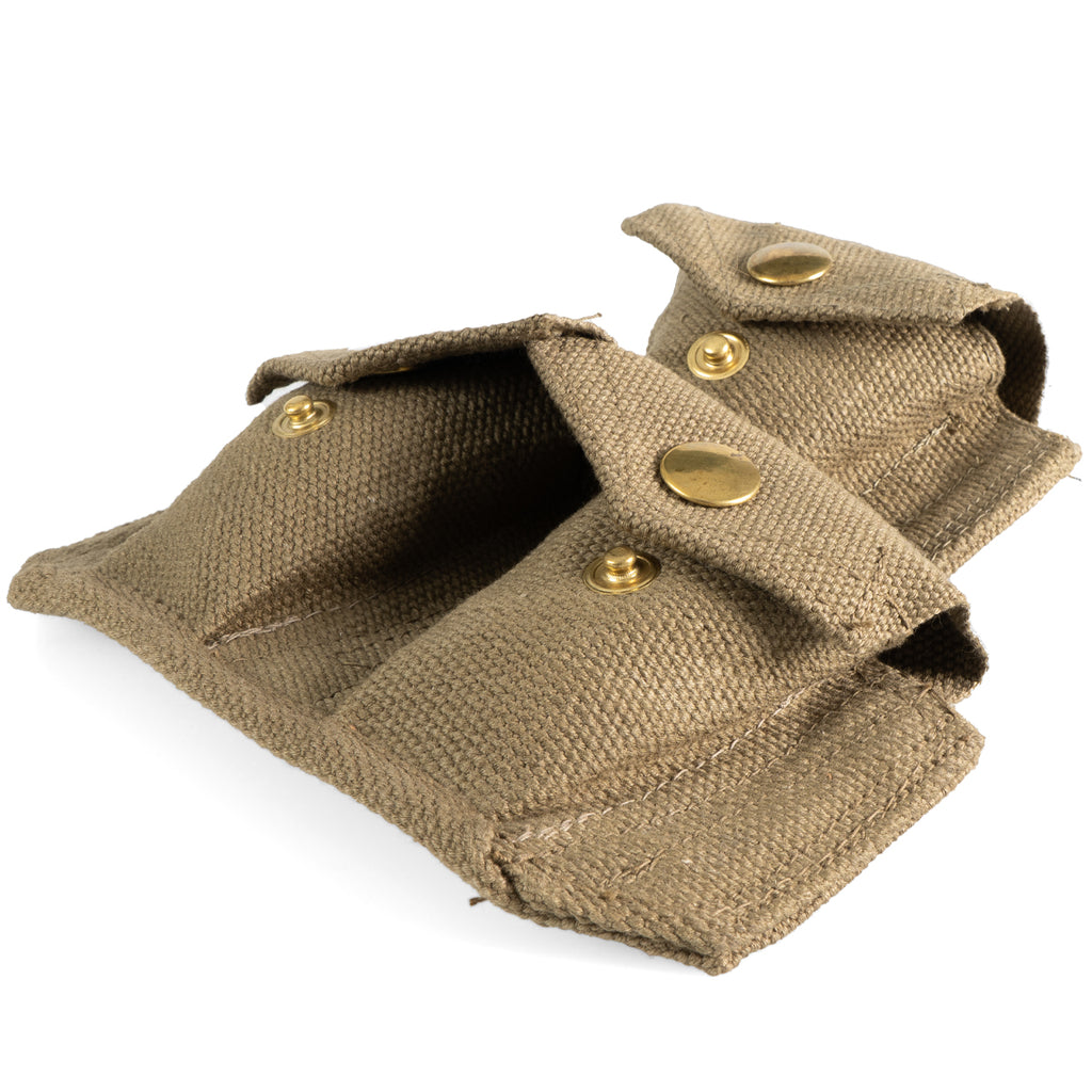Angled perspective of Italian triple ammo pouch highlighting the three-pocket design and aged brass hardware fittings.
