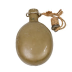 Vintage Czech M60 canteen featuring an olive green aluminium bottle and a traditional tethered cork stopper.