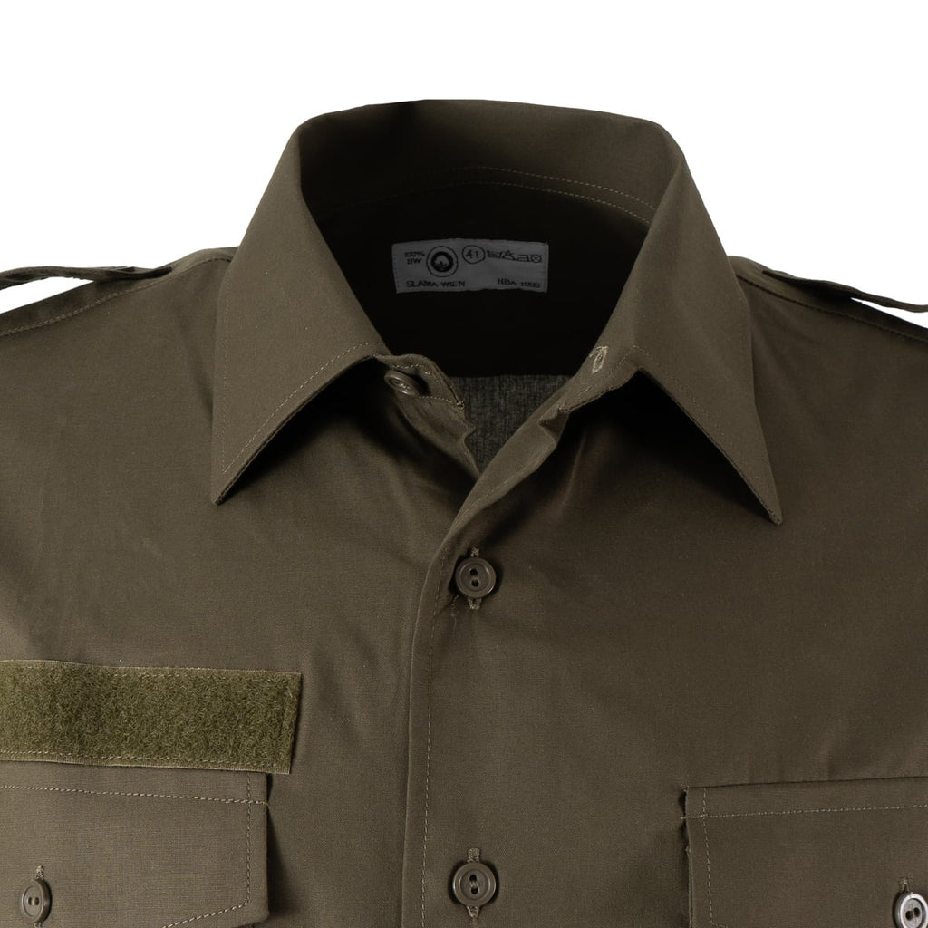 Close-up of the collar and neck label of the Austrian Army cotton shirt, showing contract details by Slama Wien and size tag.
