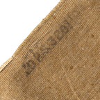 A close-up view of the original ink stamp on the brown woollen fabric of the British Army cap comforter.