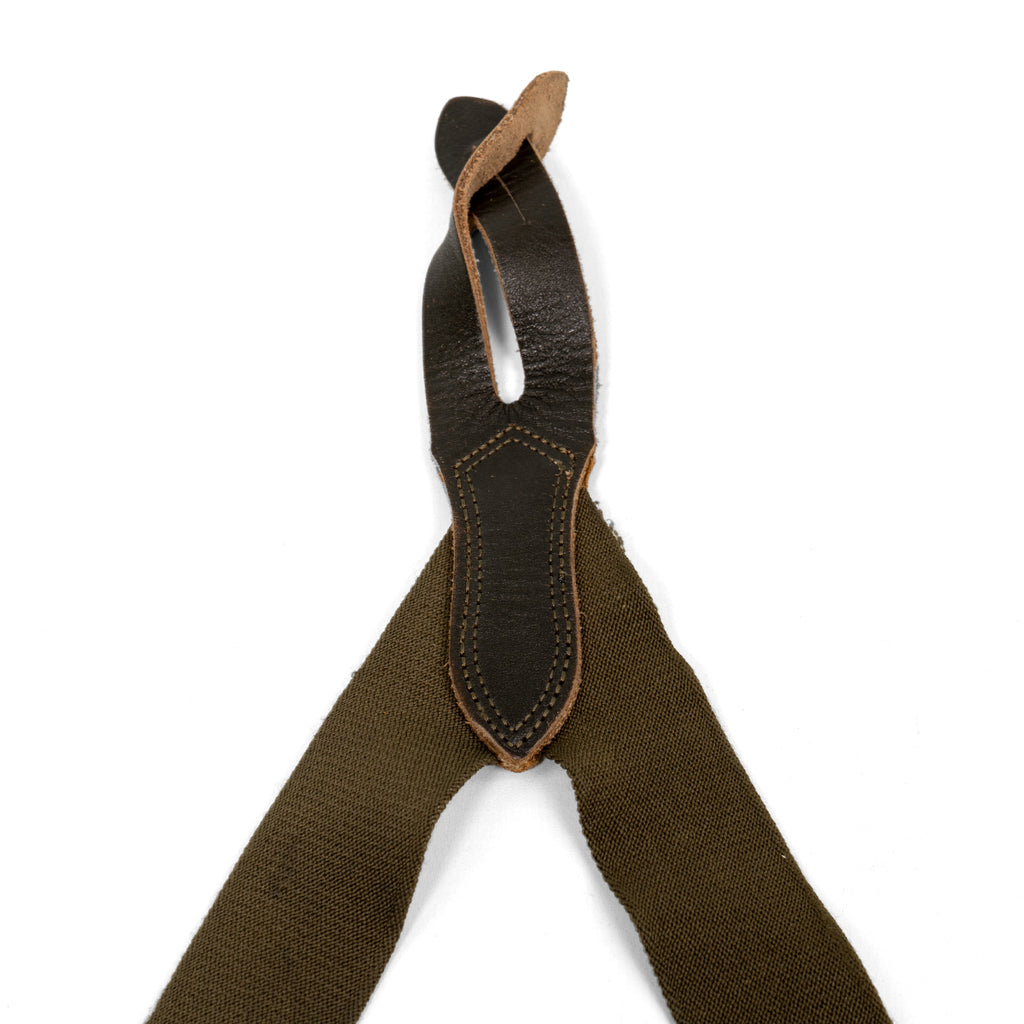 Rear Y-back junction of original BW braces featuring reinforced dark brown leather stitching and heavy-duty olive elasticated webbing.