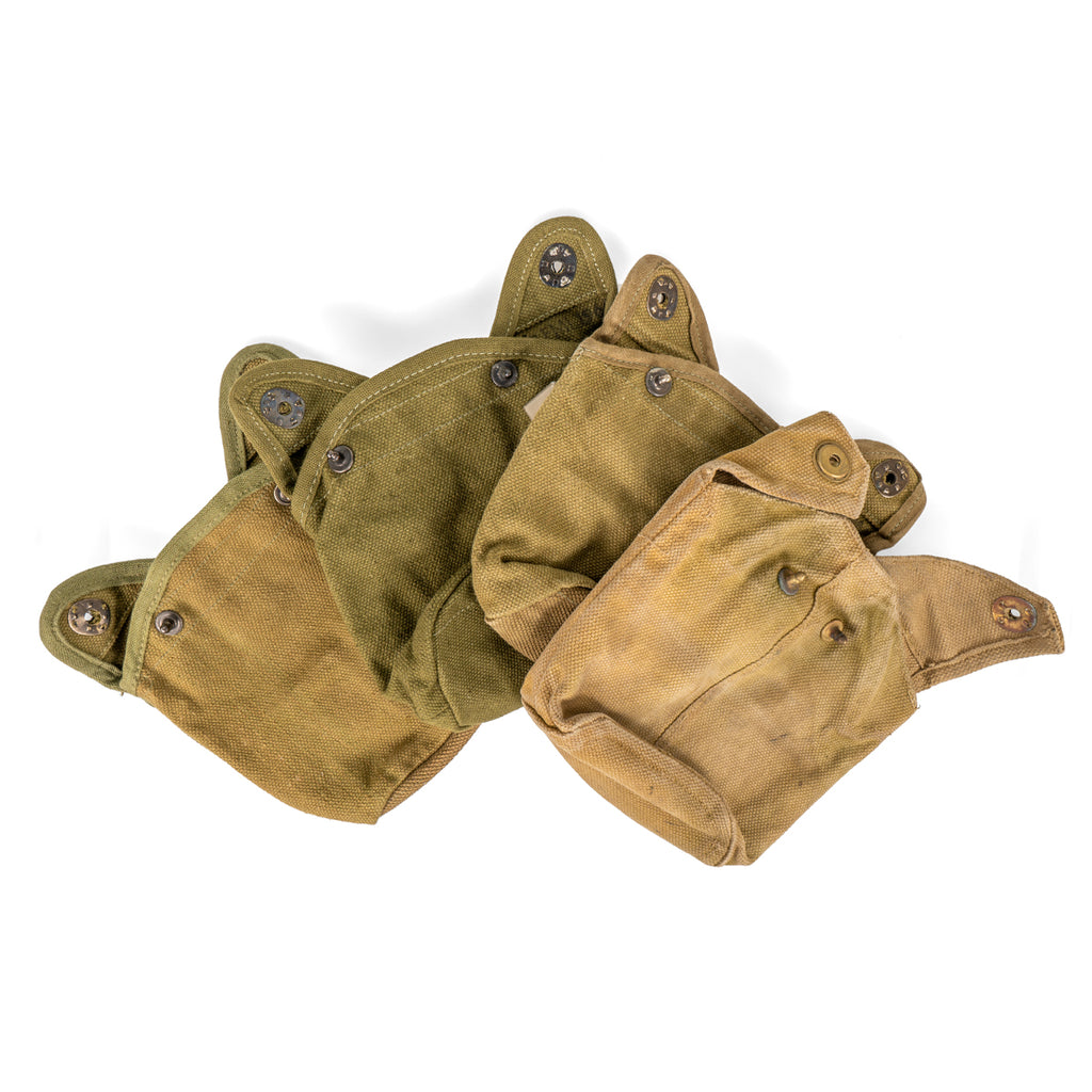 Collection of multiple original Danish M45 army canteen pouches varying in shade, showcasing the unique character and historic field wear of this surplus military gear.