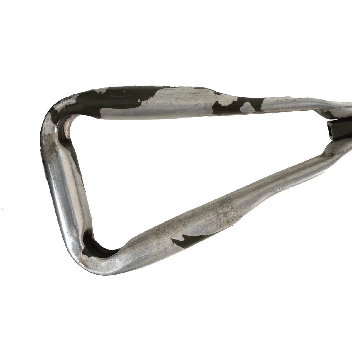 Close-up detail of the durable, triangular metal handle of the Dutch army entrenching tool with worn military finish.