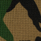 Detailed view of the high-quality woven polyester fabric showing the classic woodland camouflage pattern.