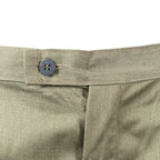 Close-up of the button fly closure and waistband details on original East German NVA military combat field trousers.