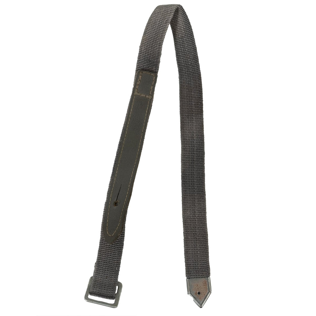 Original East German NVA grey Dederon utility strap with a Lederol synthetic leather tab, steel buckle, and pointed metal end.