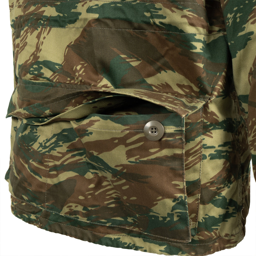 Detail view of a large front storage pocket on the Greek M65 field jacket with a secure button-down flap.