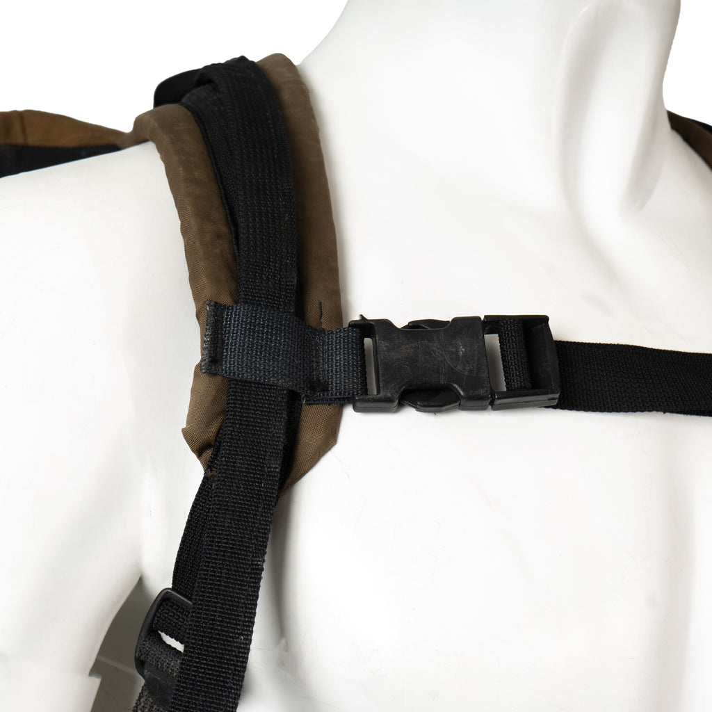 Close-up of the durable ITW Nexus polymer buckle on the shoulder harness system of the South African SADF Pattern 83 rucksack.