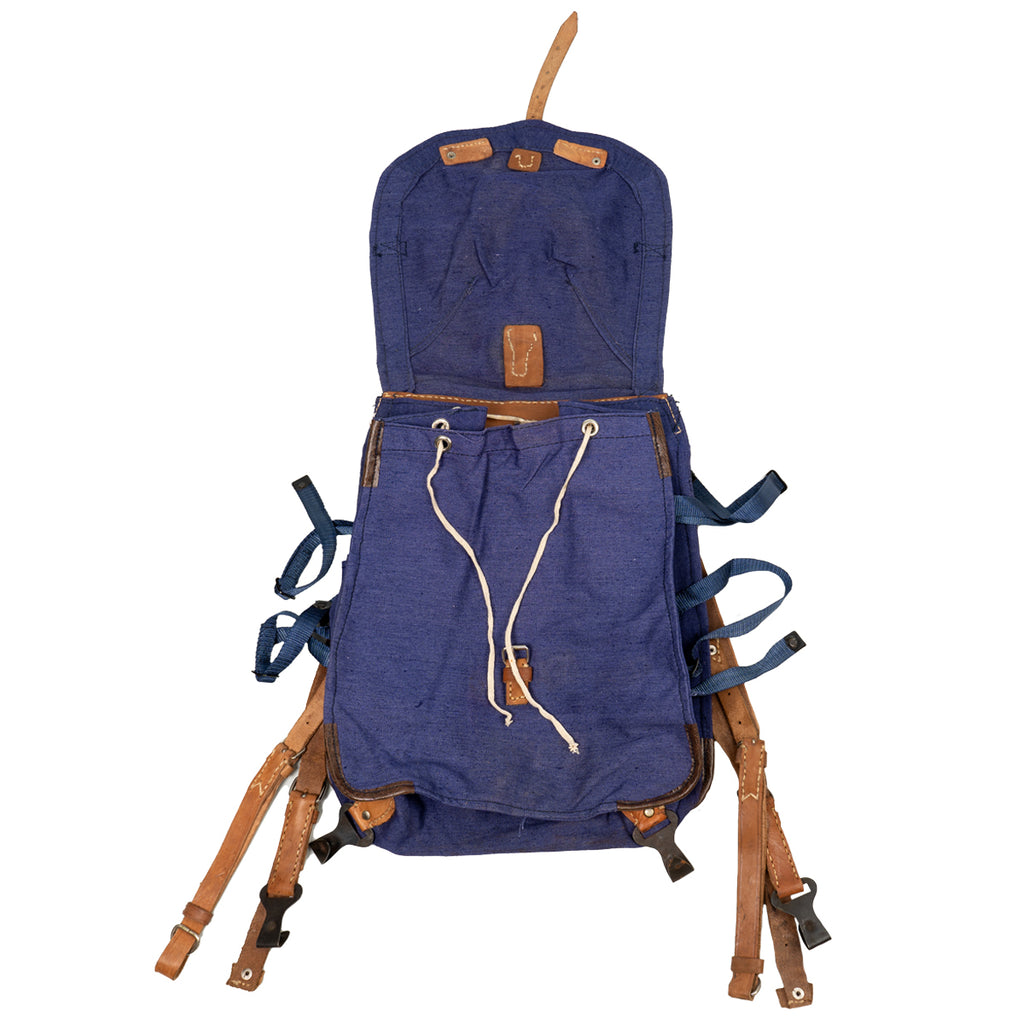 Open view of the blue Romanian military rucksack displaying the drawstring main compartment closure and robust leather harness system.