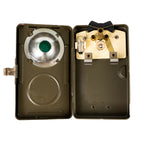 Internal view of a Type 2 Swiss Army military torch revealing the bulb, dimming mechanism, and reflector plate.