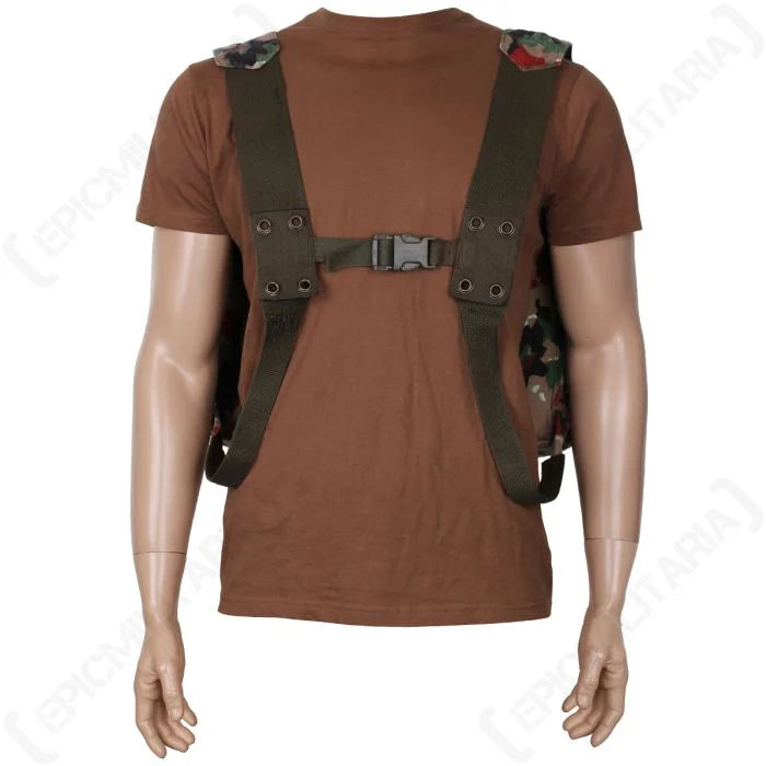 Front view on a mannequin showing the modified dark olive green shoulder straps and plastic chest buckle of the Swiss M70 pack.