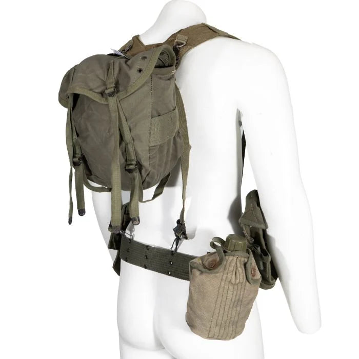 Mannequin wearing the Greek Army M56 webbing butt pack, canvas canteen cover, and H-suspenders from the rear