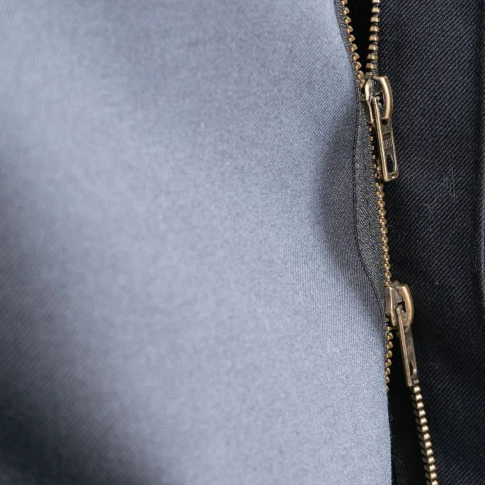 Close-up of brass Opti two-way dual zipper pull tabs on German Army Fire Brigade jacket