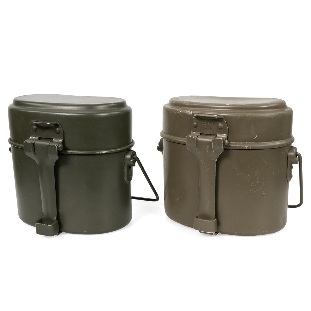 Two Austrian Army mess tin sets side by side showcasing variation in paint wear and authentic military surplus character.