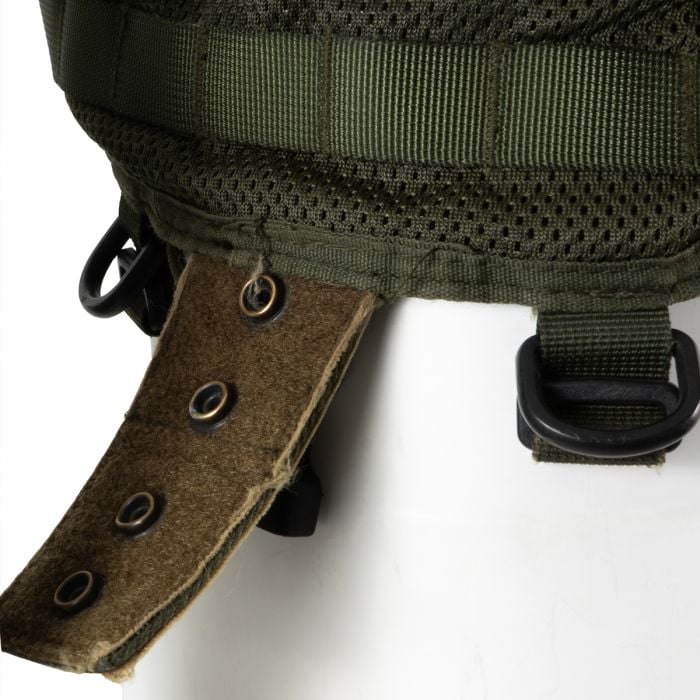 Bottom detail showing the textured attachment strap with brass eyelets