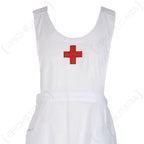 Close-up of the Red Cross nurse apron chest area, showing the textured cotton fabric and the iconic red cross emblem.