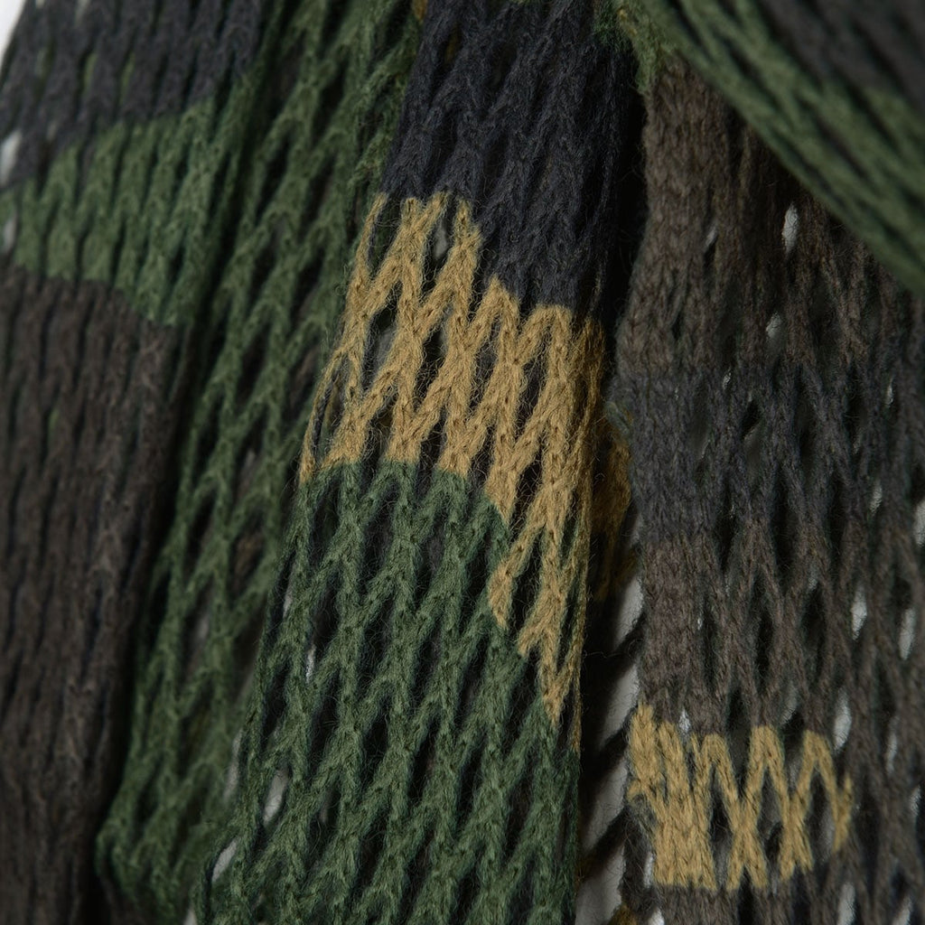 Macro close-up view of the Italian sniper scarf detailing the green, brown, and tan woodland camo pattern woven into the acrylic netting material.