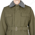 Close-up of the Czech M85 parka upper chest, showing the buttoned storm flap, grey faux-fur collar, and durable cotton-polyester canvas fabric.