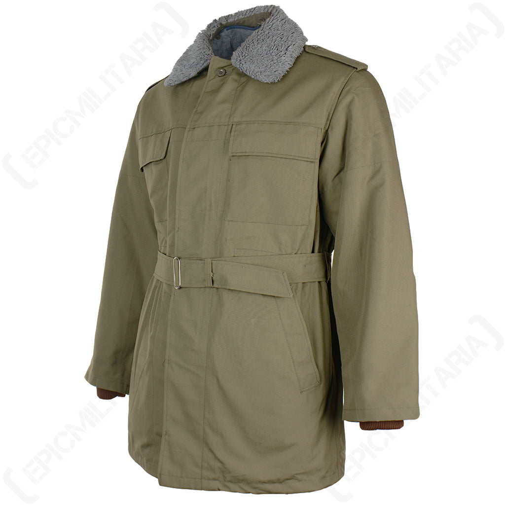Three-quarter angle of the Czech M85 field parka, showcasing the adjustable waist belt and the olive green finish of this Cold War surplus coat.
