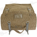 Top-down view of the NVA rucksack with the flap folded back to show the metal buckles and clear plastic identification sleeve.