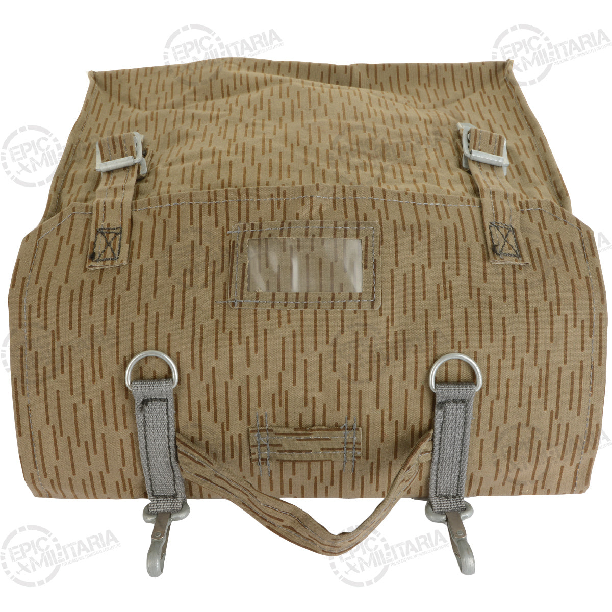 Top-down view of the NVA rucksack with the flap folded back to show the metal buckles and clear plastic identification sleeve.