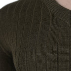 Close-up detail of the olive drab wool-blend fabric, showing the distinct vertical ribbing texture of the Czech M85 military sweater.