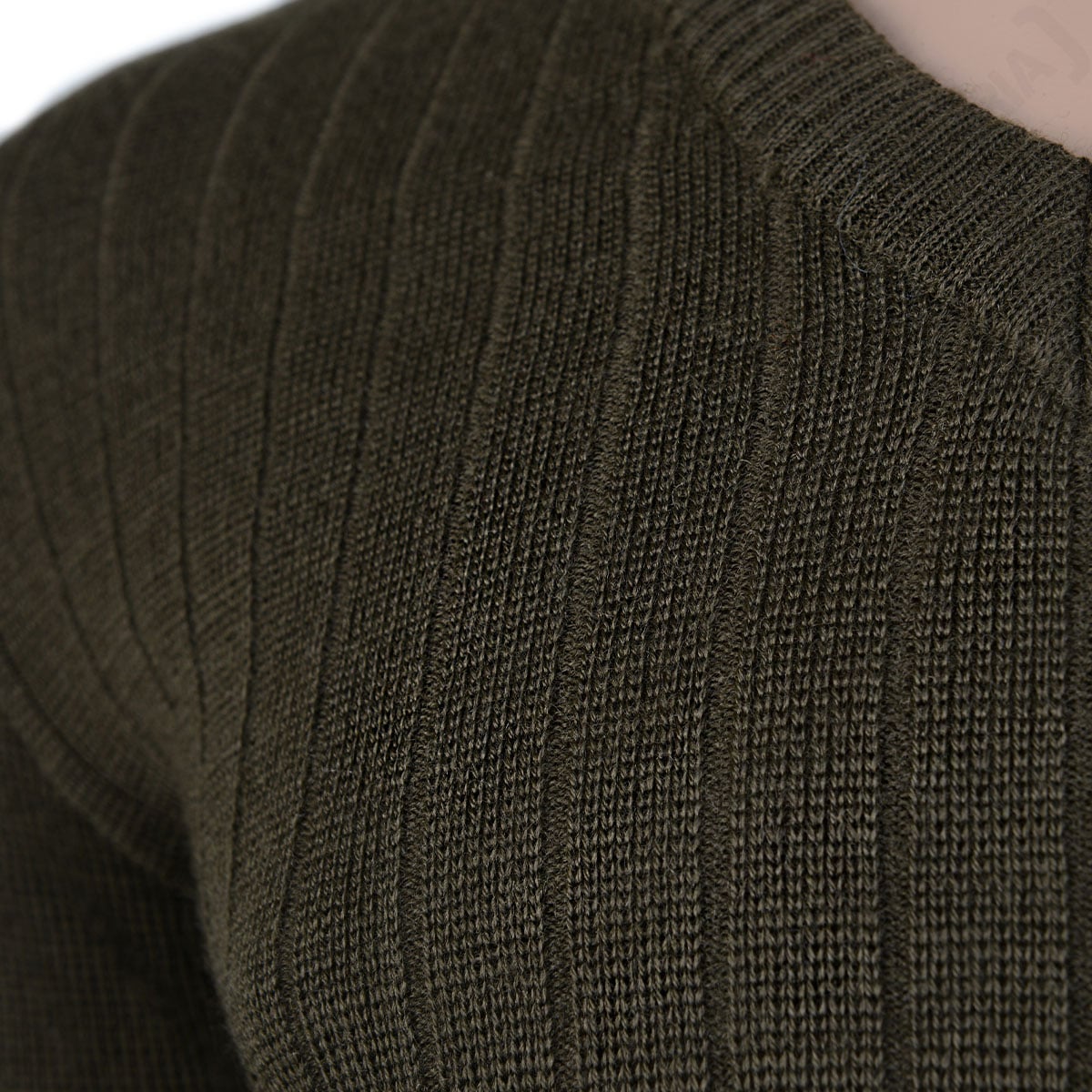 Close-up detail of the olive drab wool-blend fabric, showing the distinct vertical ribbing texture of the Czech M85 military sweater.